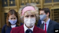 E. Jean Carroll, who says President Donald Trump raped her in the 1990s, leaves the Daniel Patrick Moynihan United States Courthouse following a hearing in her defamation lawsuit against Trump, Oct. 21, 2020, in New York. 