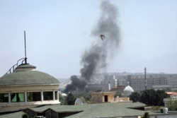 Smoke rises next to the U.S. Embassy in Kabul, Afghanistan, Aug. 15, 2021. Taliban fighters entered the Afghan capital Sunday, further tightening their grip on the country.