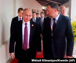 Russia's President Vladimir Putin and Russian metals magnate Oleg Deripaska walking to attend the APEC Business Advisory Council dialogue in Danang, Vietnam, November 10, 2017. Deripaska is among many other individuals targeted by the April 6 sanctions.