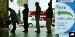 FILE - Voters line up at a polling station to vote in Florida's presidential primary in Coral Gables, Florida. A survey by the political website Politico and the polling company Morning Consult suggested many Americans are skeptical about the integrity of the national election.