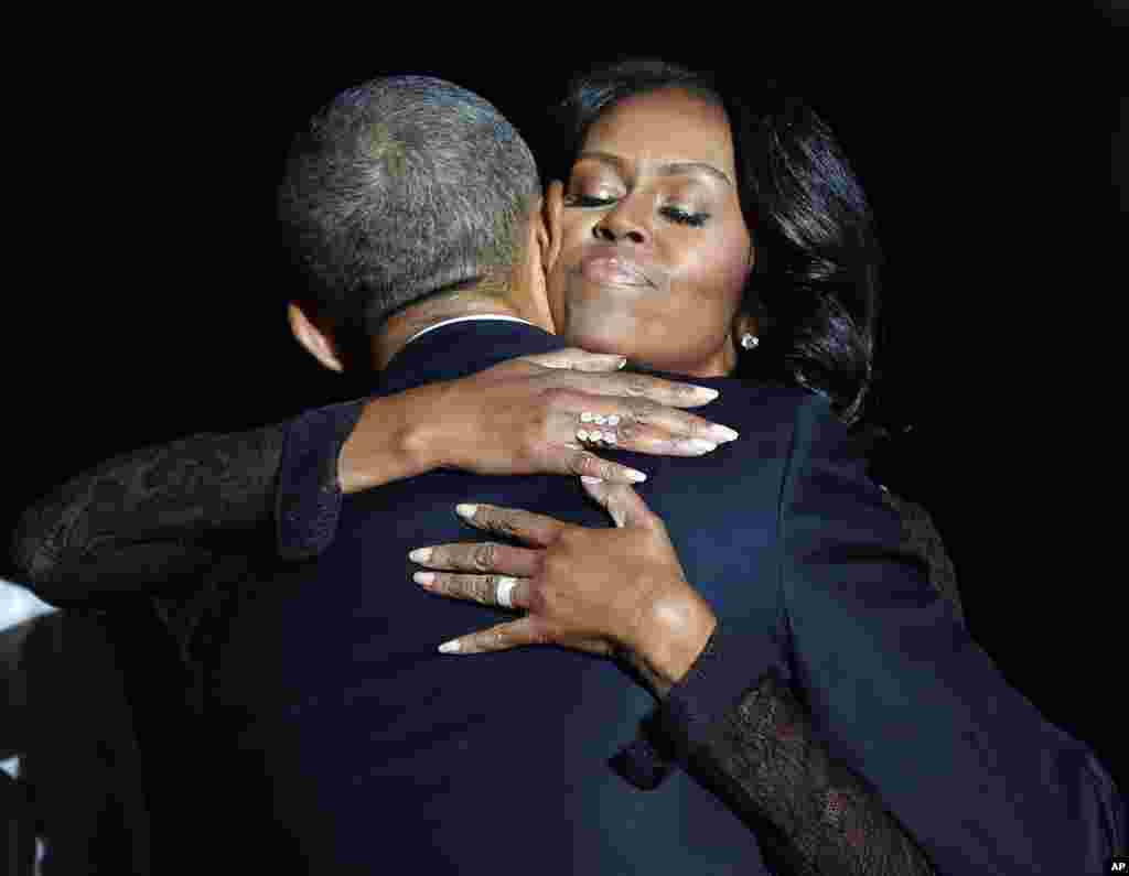 First lady Michelle Obama hugs President Barack Obama after his farewell address at McCormick Place in Chicago, Jan. 10, 2017.