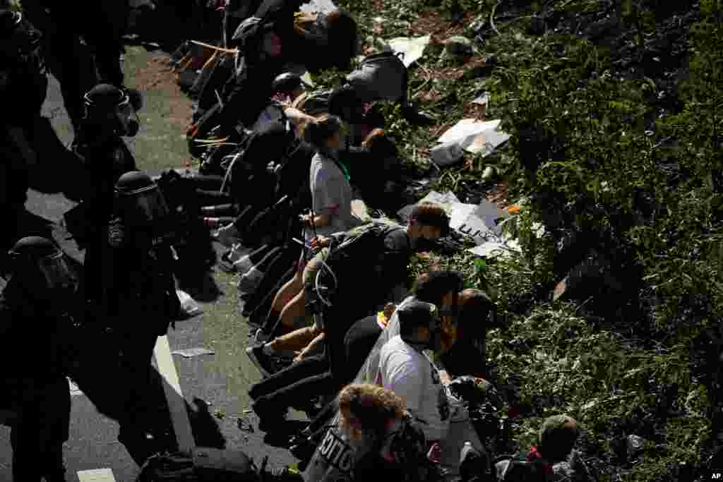 Police detain protesters on Interstate 676 in Philadelphia, Pennsylvania, in the aftermath of a march calling for justice over the death of George Floyd, June 1, 2020.