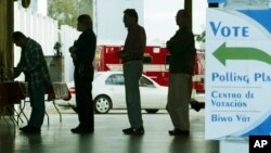 FILE - Voters line up at a polling station to vote in Florida's presidential primary in Coral Gables, Florida. 