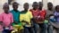 Children displaced as a result of Boko Haram attacks in the northeast region of Nigeria, eat their meal at a camp for internally displaced persons (IDP) in Yola, Adamawa State, Jan. 13, 2015. 