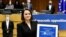 Belarus' opposition leader Sviatlana Tsikhanouskaya poses with the Sakharov Prize, European Union's annual human rights award, during a ceremony at the EU Parliament in Brussels, Belgium, Dec. 16, 2020. (John Thys/Pool via Reuters)