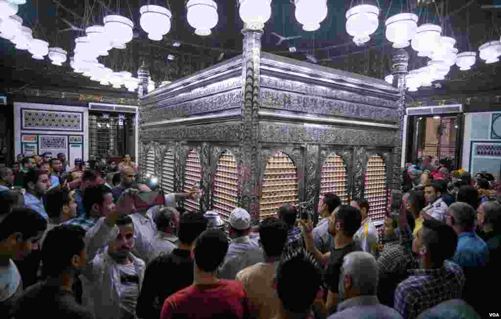  Sufi Muslims celebrate the Islamic new year by the shrine of “Al-Hussain Bin-Ali,” the grandson of the Prophet Mohamed. (H. Elrasam/VOA)
