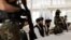 FILE - Afghanistan Taliban officials attend a news conference in Kabul, Afghanistan October 5, 2021. 