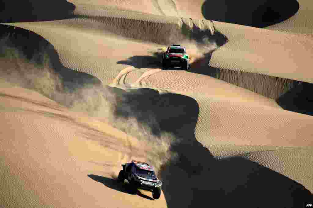 Drivers compete in Stage 2B of the 47th Dakar Rally between Bisha and Bisha, Saudi Arabia.