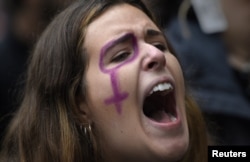 A woman shouts a slogan during the rally on the International Day for the Elimination of Violence Against Women in Oviedo, northern Spain, Nov. 25, 2017.