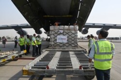 Relief supplies from the United States in the wake of India's COVID-19 situation arrive at the Indira Gandhi International Airport cargo terminal in New Delhi, India, April 30, 2021. (Prakash Singh/Pool via AP)