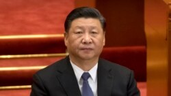 In this March 12, 2019, file photo, Chinese President Xi Jinping attends a plenary session of China's National People's Congress (NPC) at the Great Hall of the People in Beijing.