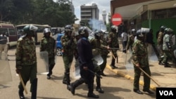 Nairobi anti-riot police disperse small groups of protesters with tear gas ahead of anti-electoral commission demonstrations, May 23, 2016. (Jill Craig/VOA)