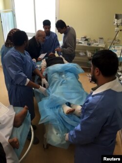 An injured man receives treatment inside a hospital in Misurata, Libya, after a truck bomb exploded at a police training center in the town of Zliten, Jan. 7, 2016.