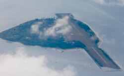 FILE - Philippine-claimed Thitu island, part of the Spratlys group of islands, is shown April 21, 2017.
