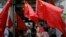 FILE - China supporters march with Chinese national flags during a rally to mark the 18th anniversary of Hong Kong's handover to China, in Hong Kong, July 1, 2015.