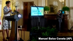 First lady Michelle Obama speaks in the East Room of the White House in Washington about a new part of her Reach Higher initiative.