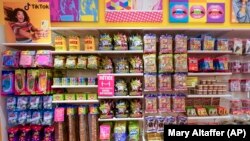 Candy, left, shown in TikTok videos is displayed at It'Sugar candy store, October 6, 2021, in New York City, NY. (AP Photo/Mary Altaffer)