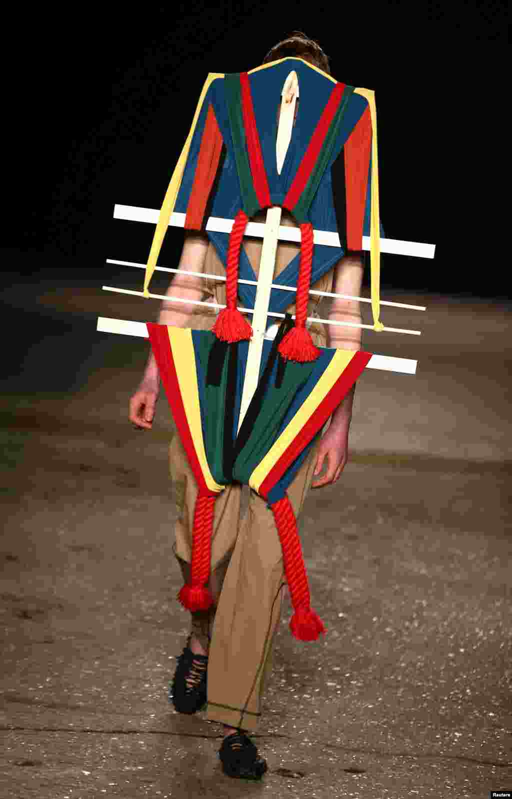 A model presents a creation at the Craig Green catwalk show at London Fashion Week Men&#39;s.