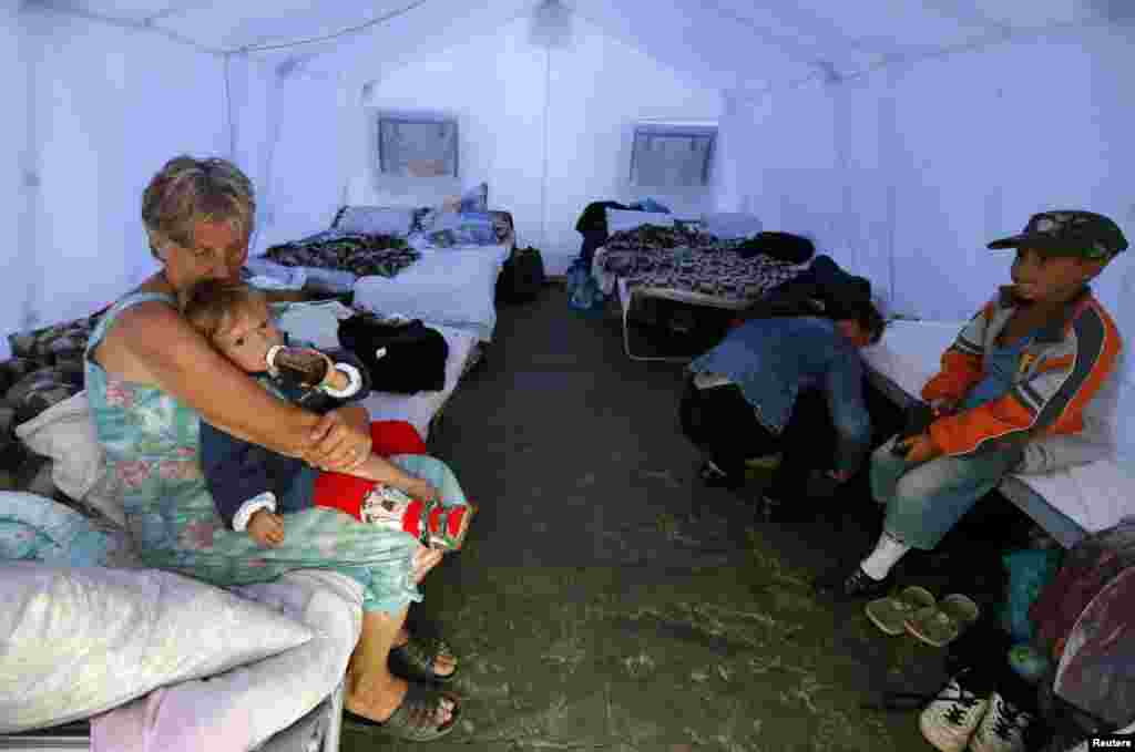 Families pour into Ukrainian refugee encampments, outside Donetsk, Aug. 18, 2014.&nbsp;