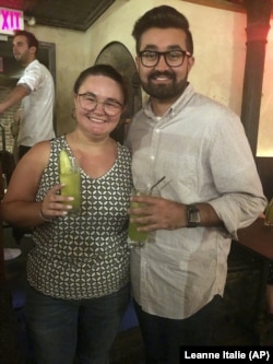 Cat Tjan, 27, and Ammar Farooqi, 26, drink mocktails.