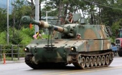 A South Korean army K-55 artillery vehicle moves through a exercise near the demilitarized zone between the two Koreas in Cheorwon, South Korea, Aug. 21, 2017.