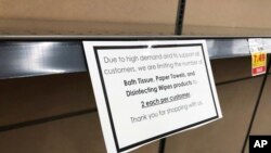 A sign limiting purchases of paper products hangs on the shelf of the paper aisle in a grocery store Nov. 4, 2020, in Denver. Colorado health officials expect coronavirus hospitalizations in the state to exceed April's high levels shortly.