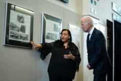 Michelle Brown-Burdex, program coordinator of the Greenwood Cultural Center, speaks as she leads President Joe Biden on a tour of the center to mark the 100th anniversary of the Tulsa race massacre, June 1, 2021, in Tulsa, Oklahoma.