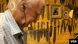 Forrest Fenn in his vault assembling Sitting Bull's original pipe. (Photo: P. Poulou / VOA )