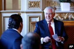 Lebanon's Prime Minister Saad Hariri (L) meets U.S. Secretary of State Rex Tillerson before a gathering of world diplomats in Paris, Dec. 8, 2017.