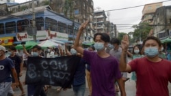 Anti-coup protesters flash the three-finger salute during a demonstration against the military takeover, in Yangon, Myanmar, Monday, May 24, 2021. (AP Photo)