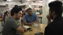 Navin Pillai, 23, center, graduated a few weeks ago from university with a degree in mechanical engineering. He says he won’t be surprised if he’s still looking for work a year from now. (Dave Grunebaum/VOA)