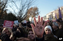 Thousands of members of Turkey's main opposition Republican People's Party march to the parliament in Ankara, Turkey, Nov. 22, 2016.