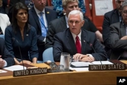 FILE - U.S. Vice President Mike Pence speaks during a high level Security Council meeting on United Nations peacekeeping operations, at U.N. headquarters, in New York, Sept. 20, 2017, as U.S. Ambassador to the U.N. Nikki Haley looks on.