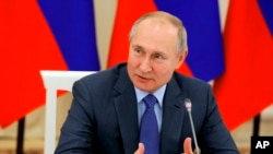 Russian President Vladimir Putin speaks during a meeting of the Council for Interethnic Relations in Nalchik, Republic of Kabardino-Balkaria, Russia, Nov. 29, 2019. 