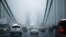 FILE - Cars make their way over the George Washington bridge in New York City in 2014.