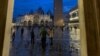 FILE - Tourists are seen in Venice's iconic St. Mark's Square after November floodwaters receded. (Sabina Castelfranco/VOA)