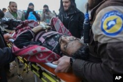 An injured Syrian arrives at a refugee camp in Rashidin, near Idlib, Syria, after he was evacuated from Aleppo during a cease-fire, Dec. 20, 2016.
