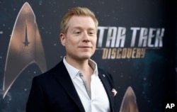 FILE - Anthony Rapp, cast member in "Star Trek: Discovery," poses at the premiere of the television series in Los Angeles, Sept. 19, 2017.
