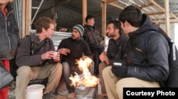 The "Salam Neighbor" filmmakers meet with refugees in Jordan's Za'atari camp. (Credit: Living on One/1001 Media)