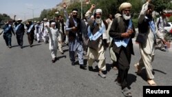 FILE - Afghan peace marchers arrive in Kabul, Afghanistan, June 18, 2018.
