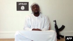 This screengrab taken on Jan. 11, 2015, from a video released on Islamist social networks shows a man allegedly claiming to be Amedy Coulibaly, who is suspected of killing a policewoman in Montrouge on January 8 and four hostages after seizing a Kosher s