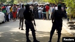 FILE - Policemen stand guard as supporters of Indigenous People of Biafra leader Nnamdi Kanu rally in Abuja, Nigeria Dec. 1, 2015. 