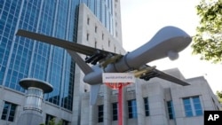 Scale model drone displayed at aviation demonstration, Sacramento, Calif., April 15, 2013.