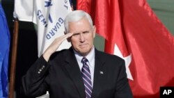 Vice President-elect Mike Pence salutes veterans during a Veterans Day ceremony at Camp Atterbury in Edinburgh, Indiana, Nov. 11, 2016. 