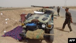 Kurdish Iraqi Peshmerga forces deploy troops on the outskirts of the multi-ethnic city of Kirkuk, only 1 kilometer away from areas controlled by Sunni Muslim Jihadists from the Islamic State of Iraq and the Levant (ISIL) in northern Iraq, June 12, 2014.
