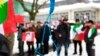 FILE - Iranian exiles shout slogans in front of a mock gallows to protest against executions in Iran during a demonstration outside the Iranian embassy in Brussels, Dec. 29, 2010.