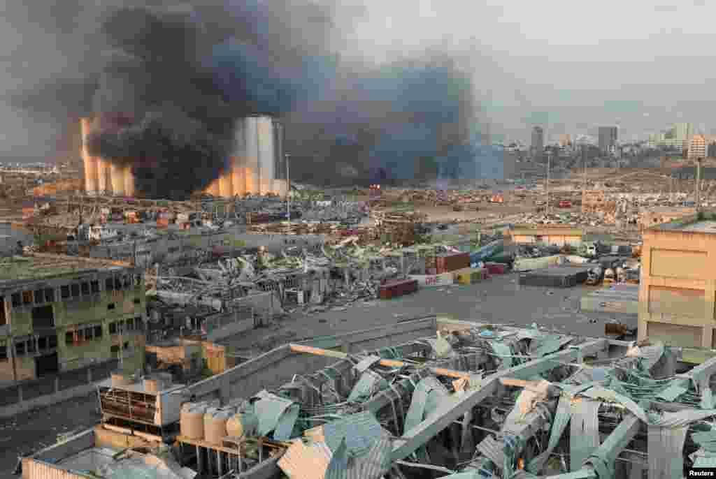 Smoke rises from the site of an explosion in Beirut, Lebanon, Aug. 4, 2020. 