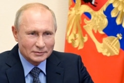 FILE - Russian President Vladimir Putin chairs a Security Council meeting via videoconference at the Novo-Ogaryovo residence outside Moscow, Russia, July 17, 2020.