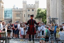 A Yeoman Warder, Barney Chandler, leads the first "Beefeater" tour of the Tower of London in 16 months, at the Tower of London, Britain, July 19, 2021.