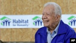 FILE - Former President Jimmy Carter is interviewed at a Habitat for Humanity project site in Memphis, Tennessee, Nov. 1, 2015.